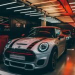 Vibrant Mini Cooper display in a stylish showroom with striking lighting.